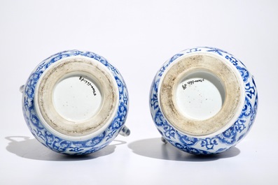 A pair of Chinese blue and white covered urns, Kangxi