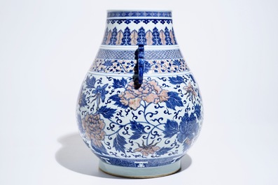 A Chinese copper-red and underglaze blue peony scroll hu vase, Qianlong mark, 19th C.