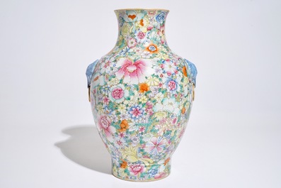 A Chinese famille rose millefleurs hu vase, Qianlong mark, 19/20th C.