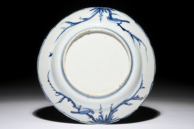 A Chinese blue and white plate with carps and butterflies, Wanli