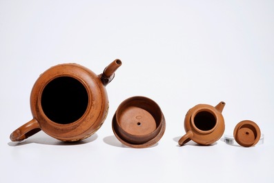 Two Chinese Yixing teapots with relief design, Kangxi and later