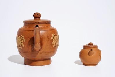 Two Chinese Yixing teapots with relief design, Kangxi and later
