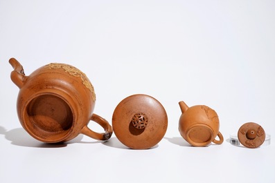 Two Chinese Yixing teapots with relief design, Kangxi and later