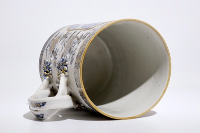 A Chinese blue, white and gilt tankard with relief design and twisted handle, Qianlong