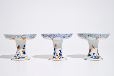 Three Chinese Imari style stem cups, Kangxi/Qianlong