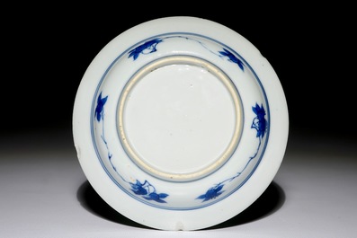 A small Chinese blue and white plate with a monk near the water, Transitional period