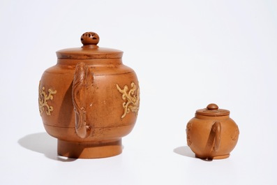 Two Chinese Yixing teapots with relief design, Kangxi and later