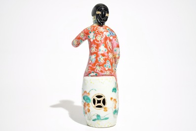 A Chinese famille rose model of a lady on a garden seat, 19th C.