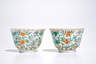 A pair of Chinese famille verte cups and saucers, Kangxi