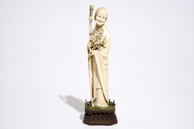 A Chinese ivory model of a lady on wooden base, 19th C.