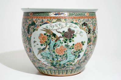 A Chinese famille verte fish bowl with a qilin and a phoenix, 19th C.