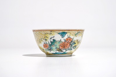 A Chinese famille rose cup and saucer with an insect on sanduo fruit, Yongzheng
