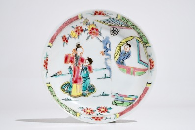 A Chinese famille rose cup and saucer with figures in a garden, Yongzheng