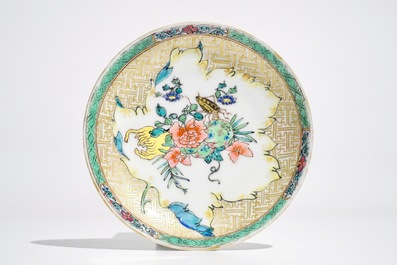 A Chinese famille rose cup and saucer with an insect on sanduo fruit, Yongzheng