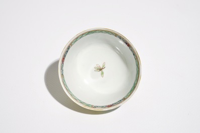 A Chinese famille rose cup and saucer with an insect on sanduo fruit, Yongzheng
