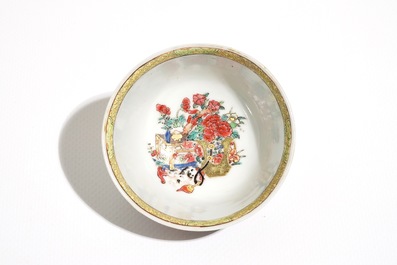 A Chinese famille rose cup and saucer with a cat, Yongzheng