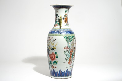 A tall Chinese famille rose vase with a court scene and peacocks, 19th C.