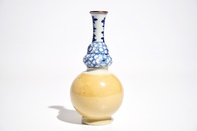 A Chinese blue and white and caf&eacute; au lait double gourd vase, Kangxi