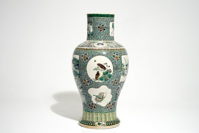 A Chinese verte enamel on biscuit vase with a fluvial landscape, Kangxi