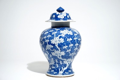 A Chinese blue and white baluster vase and cover with prunus on cracked ice, Kangxi