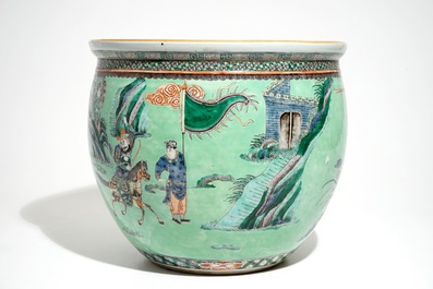 A Chinese famille verte green-ground fish bowl with warriors on horseback, 19th C.