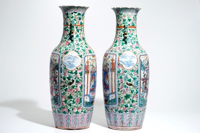 A pair of tall Chinese famille rose vases with court scenes, 19th C.
