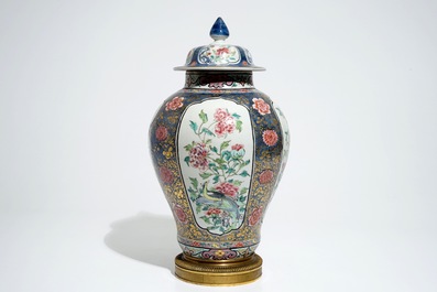 A Chinese bronze-mounted famille rose on blue-ground baluster vase and cover, Yongzheng