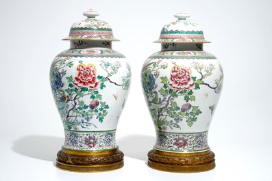 A pair of tall bronze-mounted famille rose baluster vases and covers, Samson, Paris, 19th C.