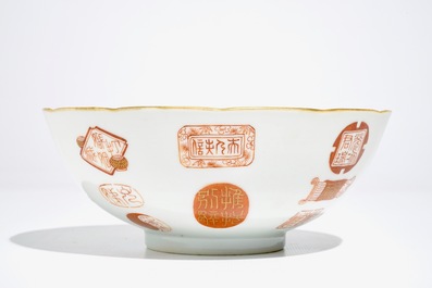 A Chinese iron red and gilt bowl with Taoist symbols and marks, Qianlong mark, 19/20th C.