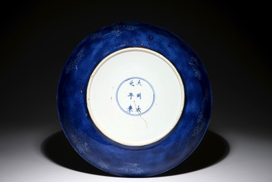 A large Chinese blue and white charger with floral design and powder blue back, Chengua mark, Kangxi