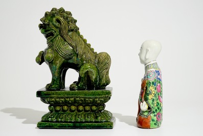 A Chinese famille rose kneeling boy and a green-glazed Ming-style temple lion, 19th C.