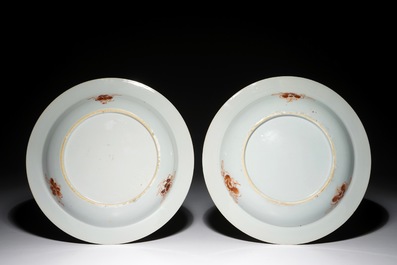 A pair of Chinese famille rose plates with figures and a phoenix, Yongzheng