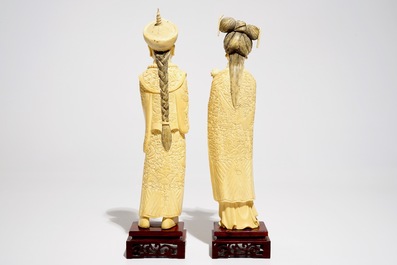 A pair of Chinese carved ivory figures of the emperor and his wife, early 20th C.