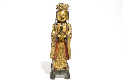 Een Chinese deels vergulde en polychrome bronzen figuur van Wenchang Dijun, Ming