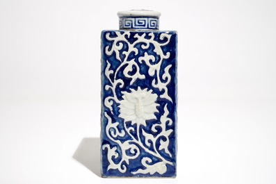 A Chinese blue and white tea caddy and cover with applied design, 19th C.