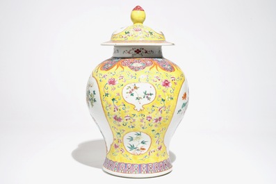 A Chinese famille rose baluster vase and cover with design of a flowervase, 19th C.