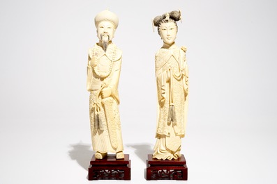 A pair of Chinese carved ivory figures of the emperor and his wife, early 20th C.