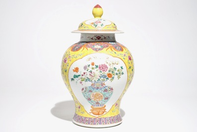 A Chinese famille rose baluster vase and cover with design of a flowervase, 19th C.