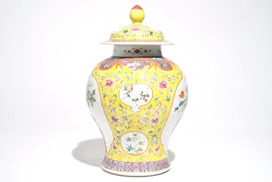 A Chinese famille rose baluster vase and cover with design of a flowervase, 19th C.