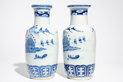 A pair of Chinese blue and white rouleau vases with landscape design, 19th C.