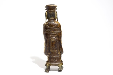 Een Chinese deels vergulde en polychrome bronzen figuur van Wenchang Dijun, Ming