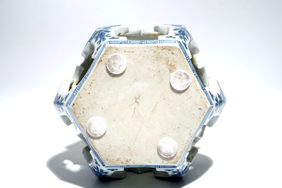A Chinese blue and white hexagonal tea cup basin or kensui with prunus on cracked ice, Kangxi