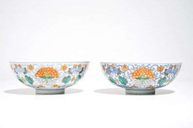 A pair of Chinese doucai bowls with floral famille rose medallions, 4-character mark, 19/20th C.