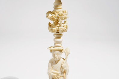 Two Chinese Canton ivory puzzle balls on stands and a figure of a sage, 19th C.