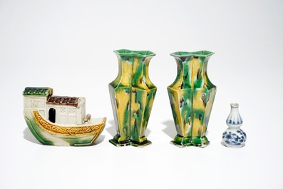 A pair of spinach and egg lozenge-shaped vases, a verte biscuit model of a boat and a miniature vase, Kangxi