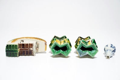 A pair of spinach and egg lozenge-shaped vases, a verte biscuit model of a boat and a miniature vase, Kangxi