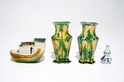 A pair of spinach and egg lozenge-shaped vases, a verte biscuit model of a boat and a miniature vase, Kangxi