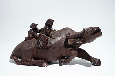 A Chinese wooden model of an ox and a wooden tray with silver handles, 19th C.