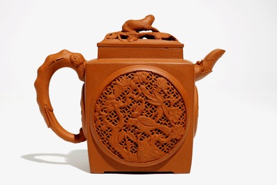 A Chinese reticulated Yixing stoneware teapot with flowers and animals, Kangxi