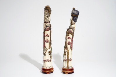 A pair of tall Chinese polychrome ivory figures, early 20th C.